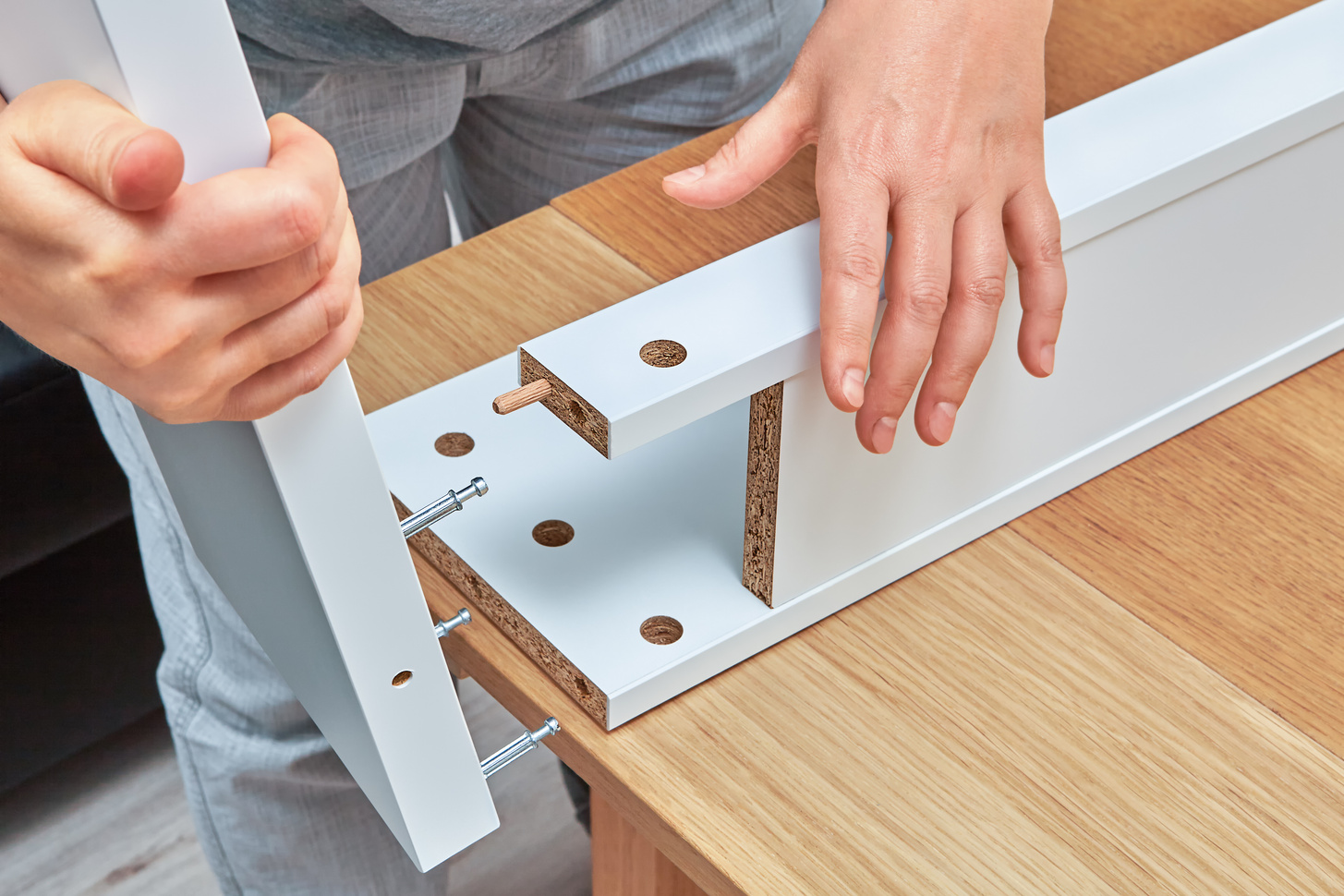 Furniture assembler connects parts of table, furniture assembly.